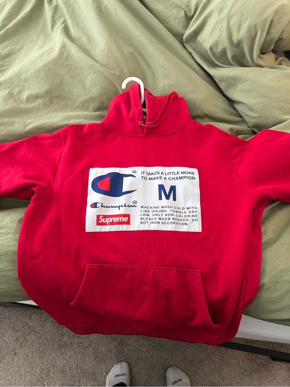 Supreme Red Pullover Hoodie with Champion Patch